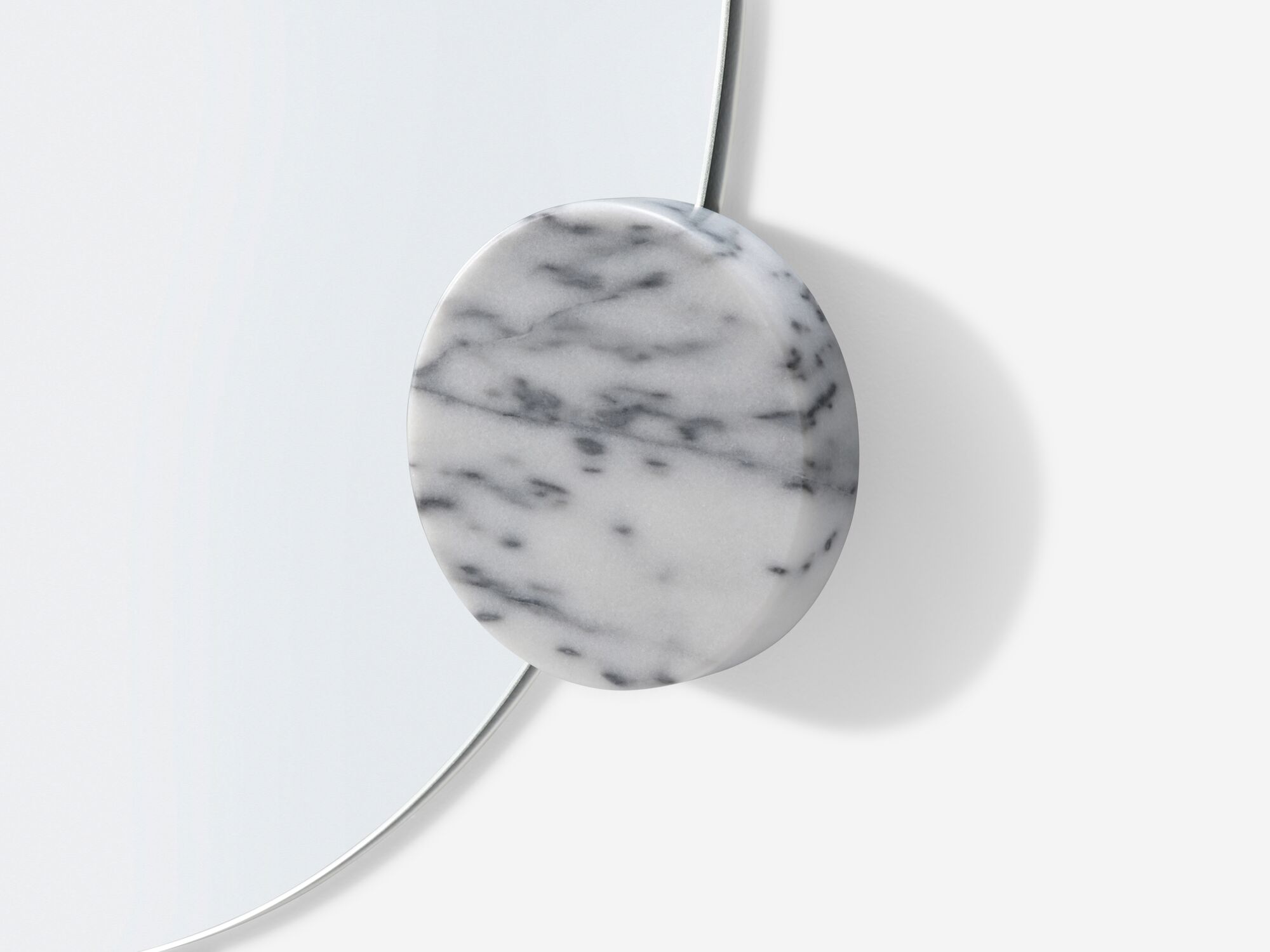 Detail knob view of modern wall mirror with white marble knobs